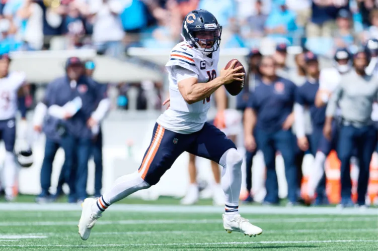 Bears explode in opener at Carolina